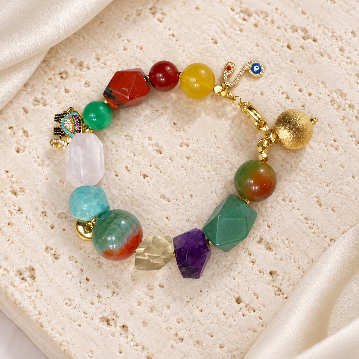 Rainbow Garden Mixed Stone Bracelet — full bracelet on a cream stone surface